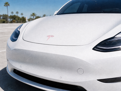 White Tesla Model Y front Tesla emblem wrapped in Gloss Pearl Tutu Pink